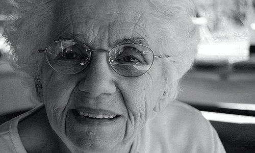 smiling black and white elderly woman